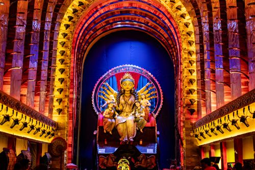 Free Colorful Durga Puja festival pandal with goddess idol in Kolkata, India, showcasing vibrant traditions. Stock Photo
