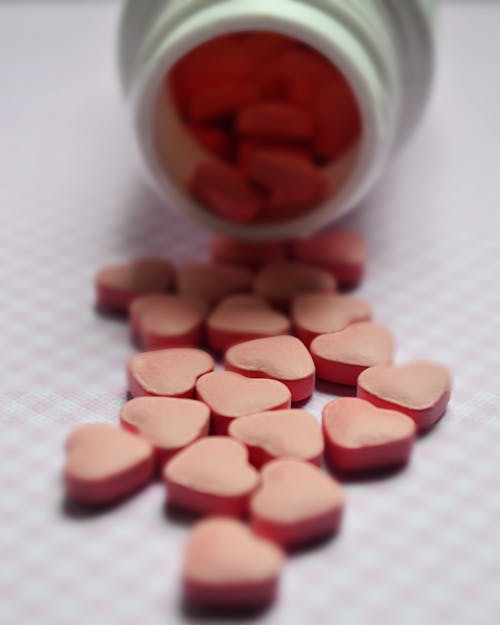 無料 ピンクの錠剤の選択的焦点写真 写真素材