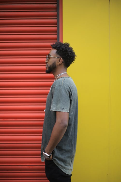 Side View Photo of Standing Man Posing