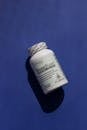 Bone Supplement Bottle on a Blue Background