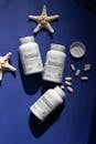 Bone Supplements with Starfish Decor on Blue Background