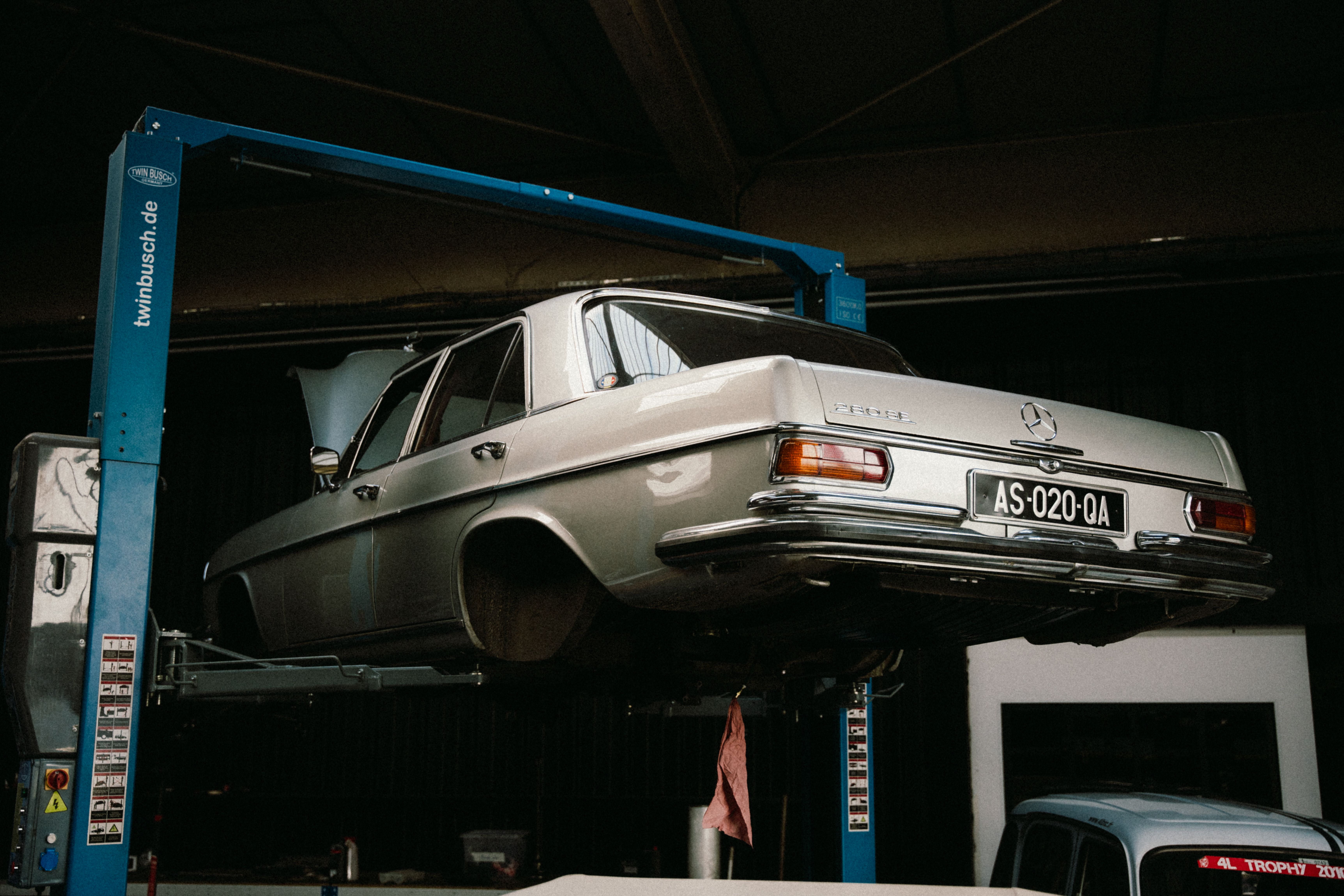 Vintage Mercedes on Lift in Auto Repair Shop