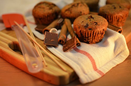 Free Chocolate Cupcakes on White Textile Stock Photo