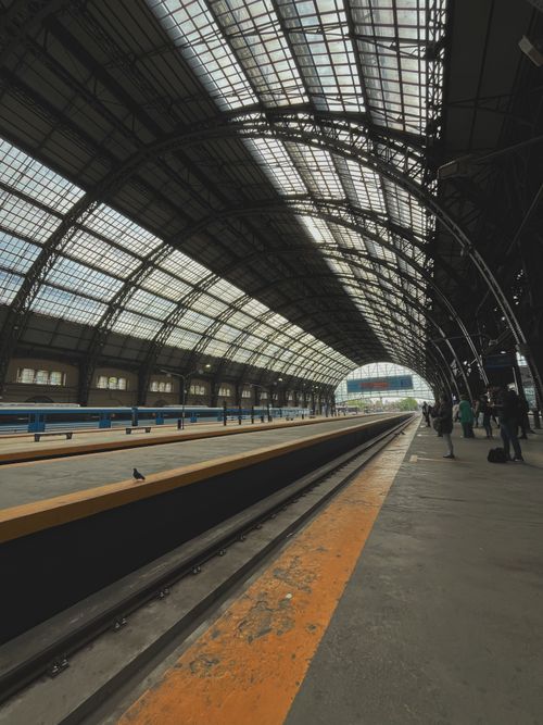 Free Interior view of the Retiro train station in Buenos Aires, Argentina, featuring its iconic arched glass roof. Stock Photo