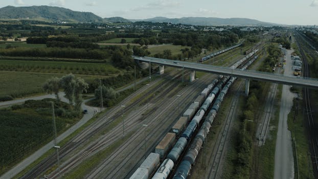 Freight train passing through Offenburg, Germany with scenic landscape view.