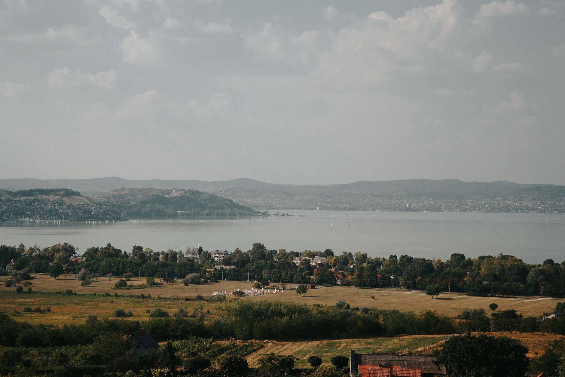 Picturesque landscape of Lake Balaton with surrounding hills in Hungary.