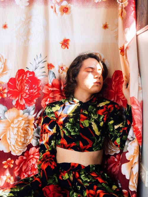 Free Closed Eyed Person Beside Floral Textile Stock Photo
