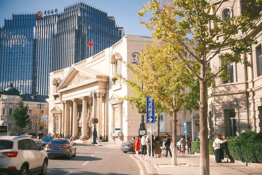 A vibrant street scene in Beijing showcasing historic architecture and modern buildings in beautiful sunlight.