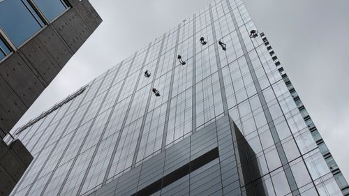 Free City high-rise men wall walking Stock Photo