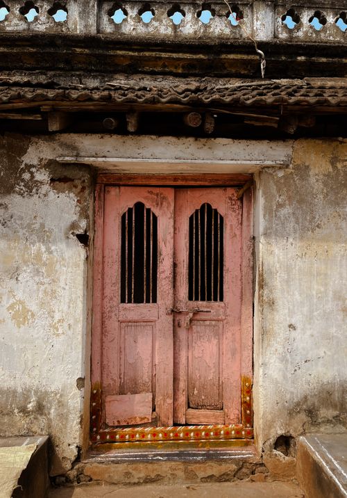 Free Vintage Indian wooden door showcasing rustic architecture and ancient aesthetics. Stock Photo