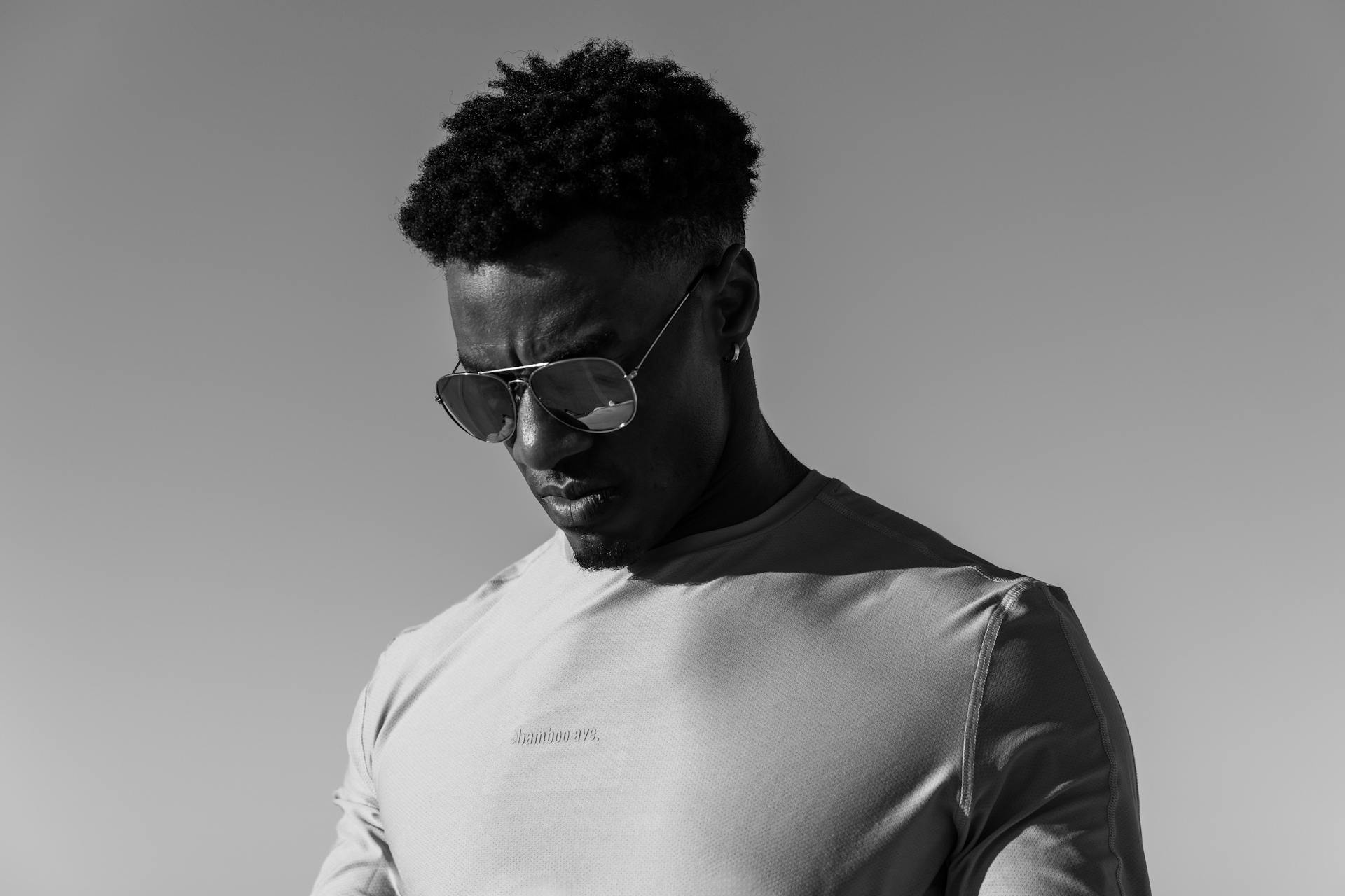 Black and white portrait of a man in athleisure wear outdoors in Austin.