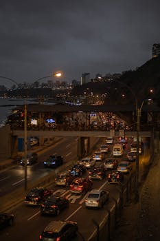 Evening traffic along the coast in Barranco, Lima, Peru, showcasing city lights.