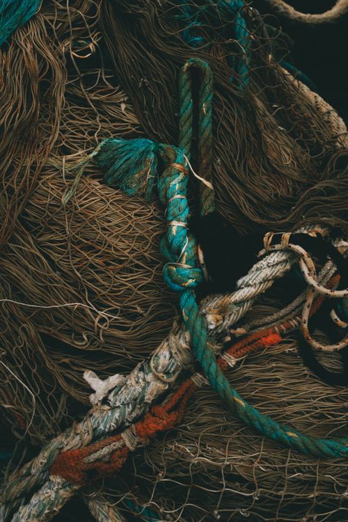 Free Close-up of tangled fishing nets with colorful rope, showcasing textures and patterns. Stock Photo