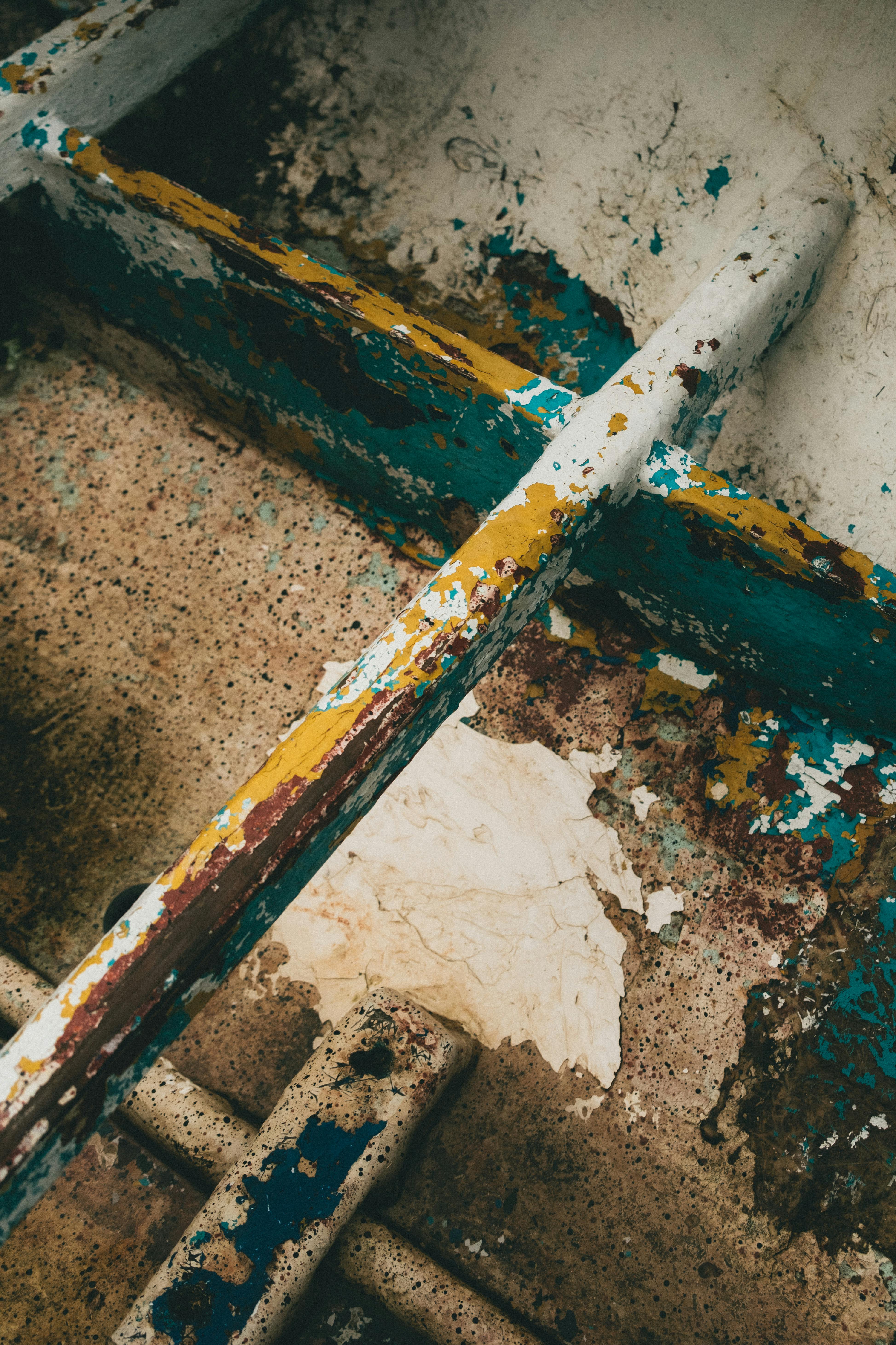 Close-up abstract image of peeling paint and rust on an old surface.