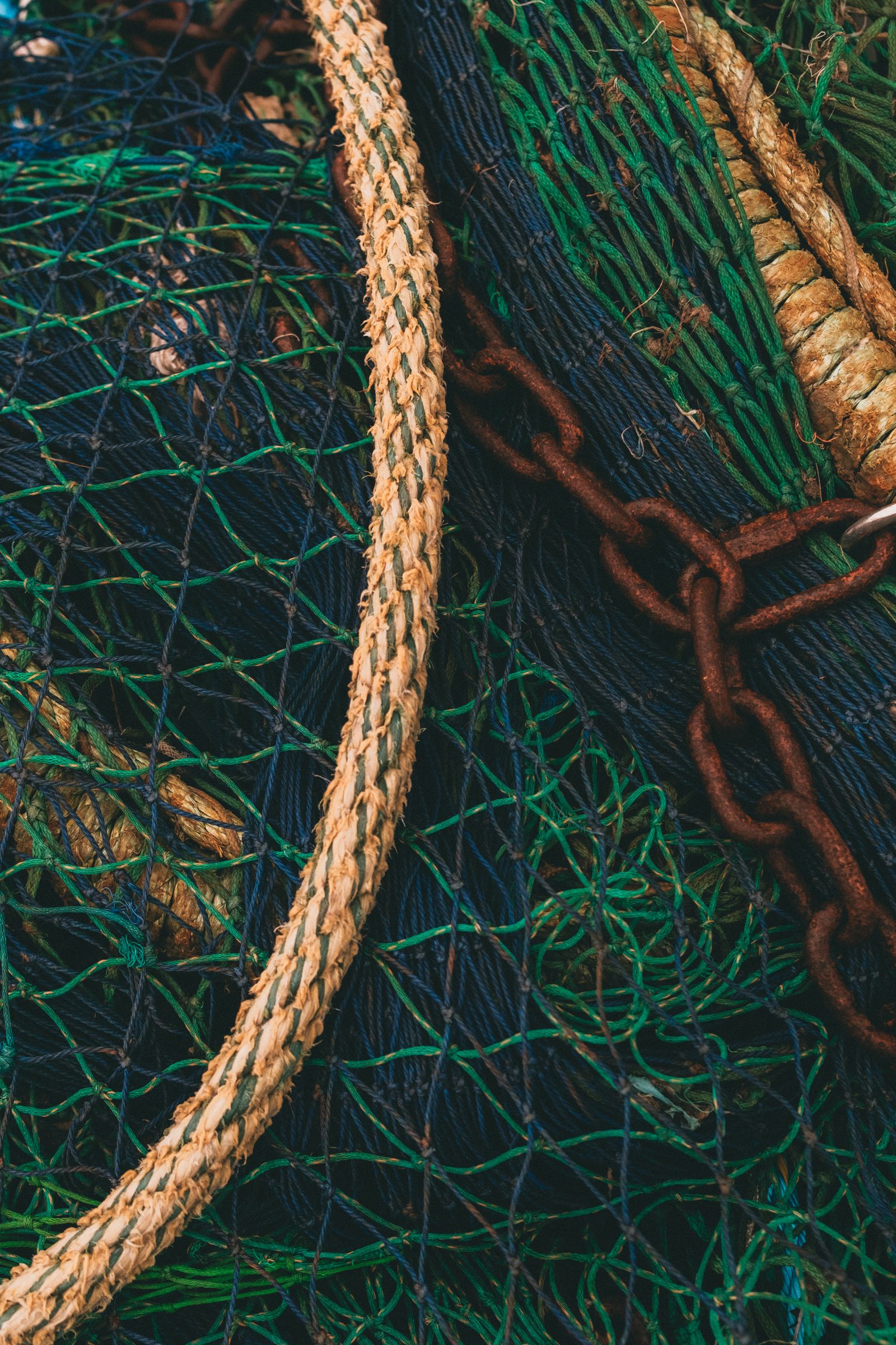 Coiled fishing rope, nets and chain, the kind of gear the shop stocks
