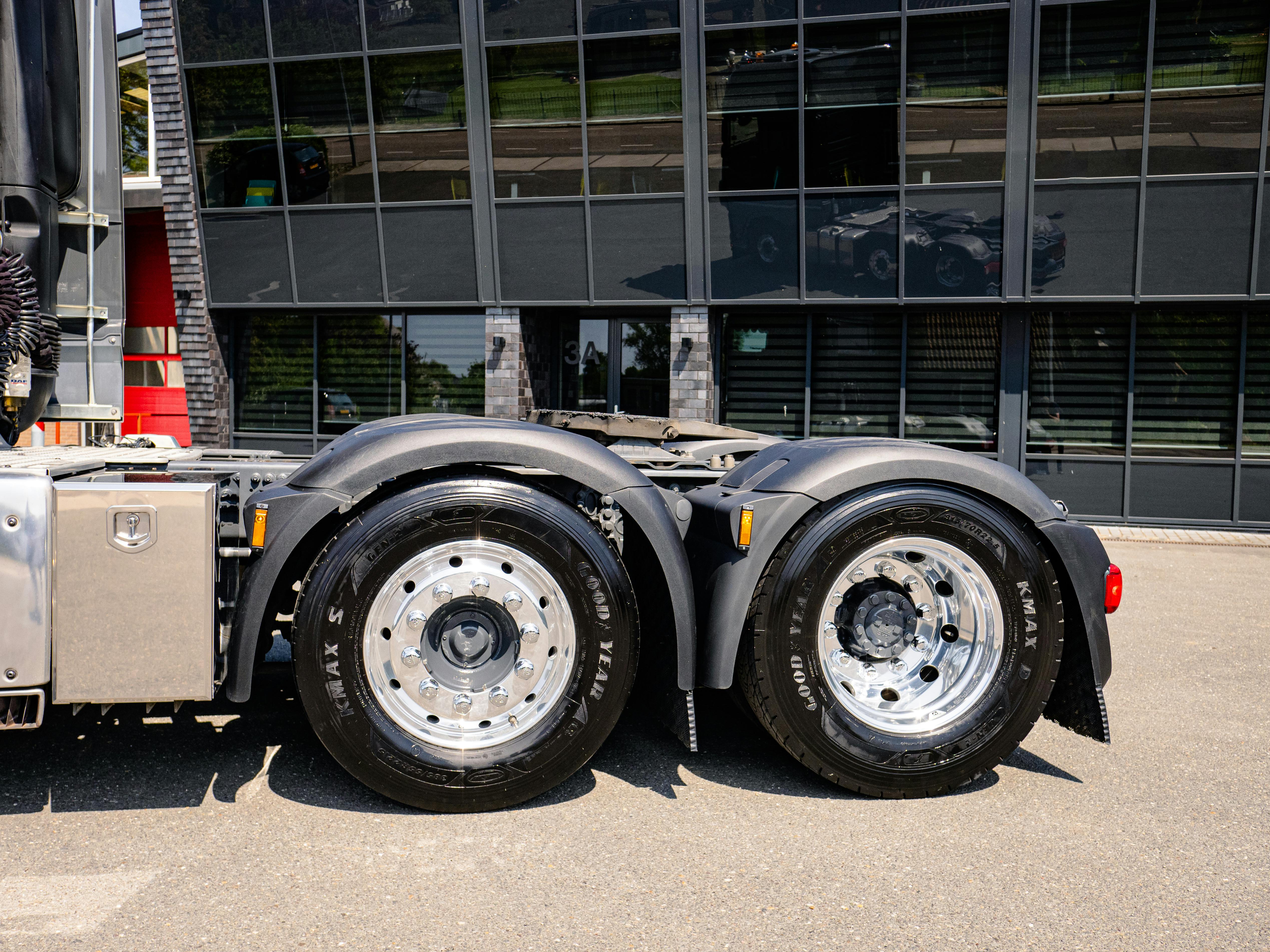 Detail of polished semi truck wheel showing reflection
