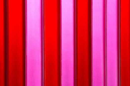 Vivid abstract image featuring vertical red and pink stripes, perfect for creative designs.