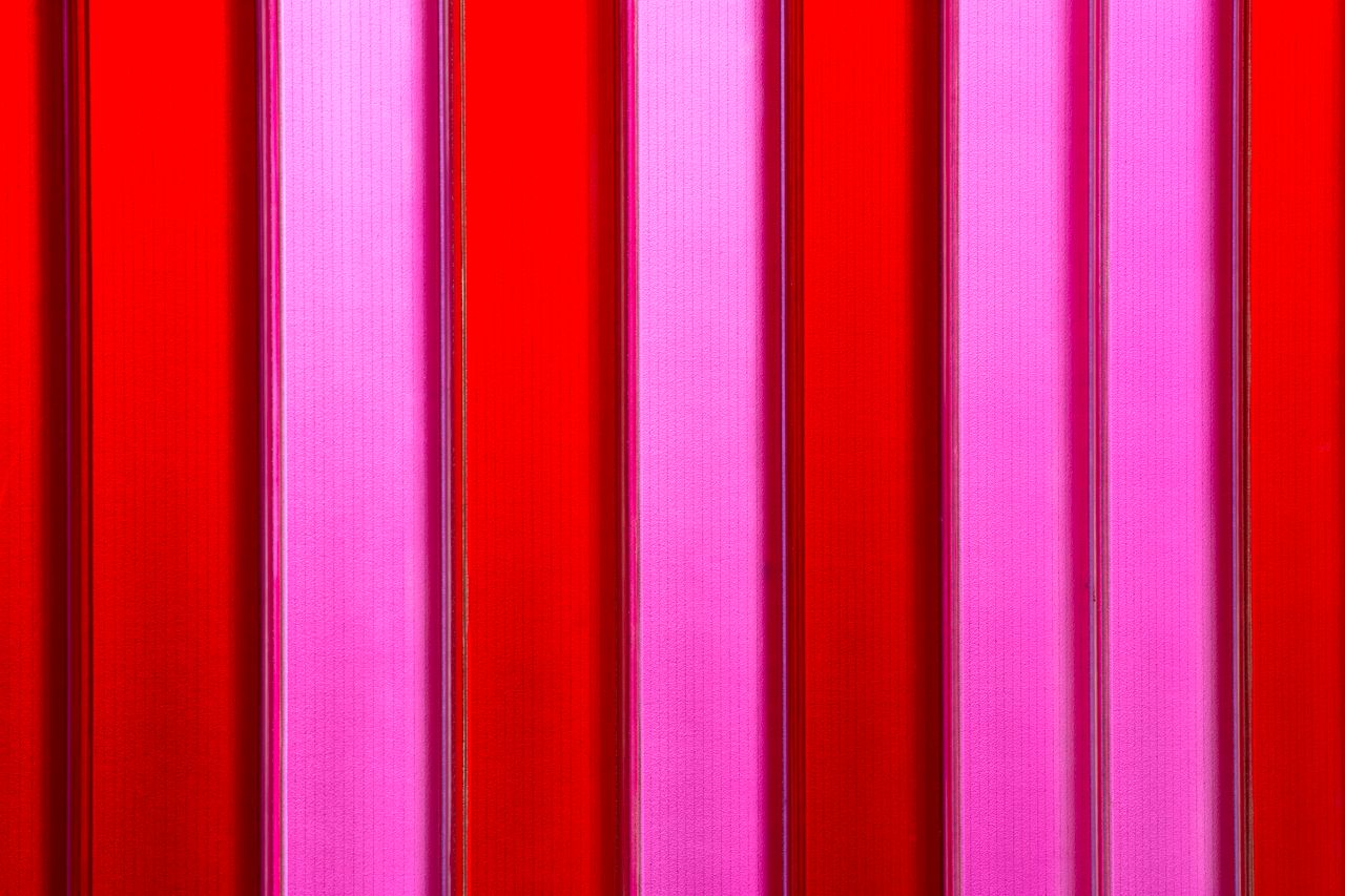 vivid abstract image featuring vertical red and pink stripes perfect f