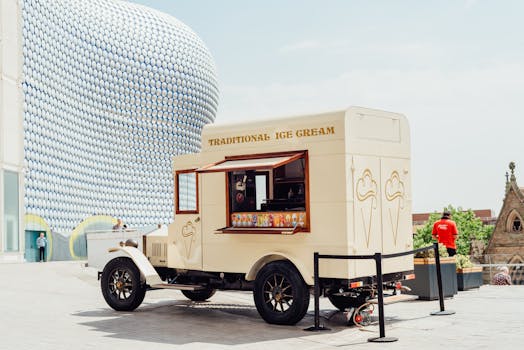 A traditional ice cream truck in a modern city setting, ideal for summer vibes.