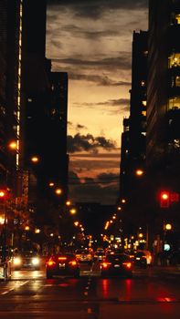 Captivating evening street scene in downtown Toronto with bustling traffic and city lights.