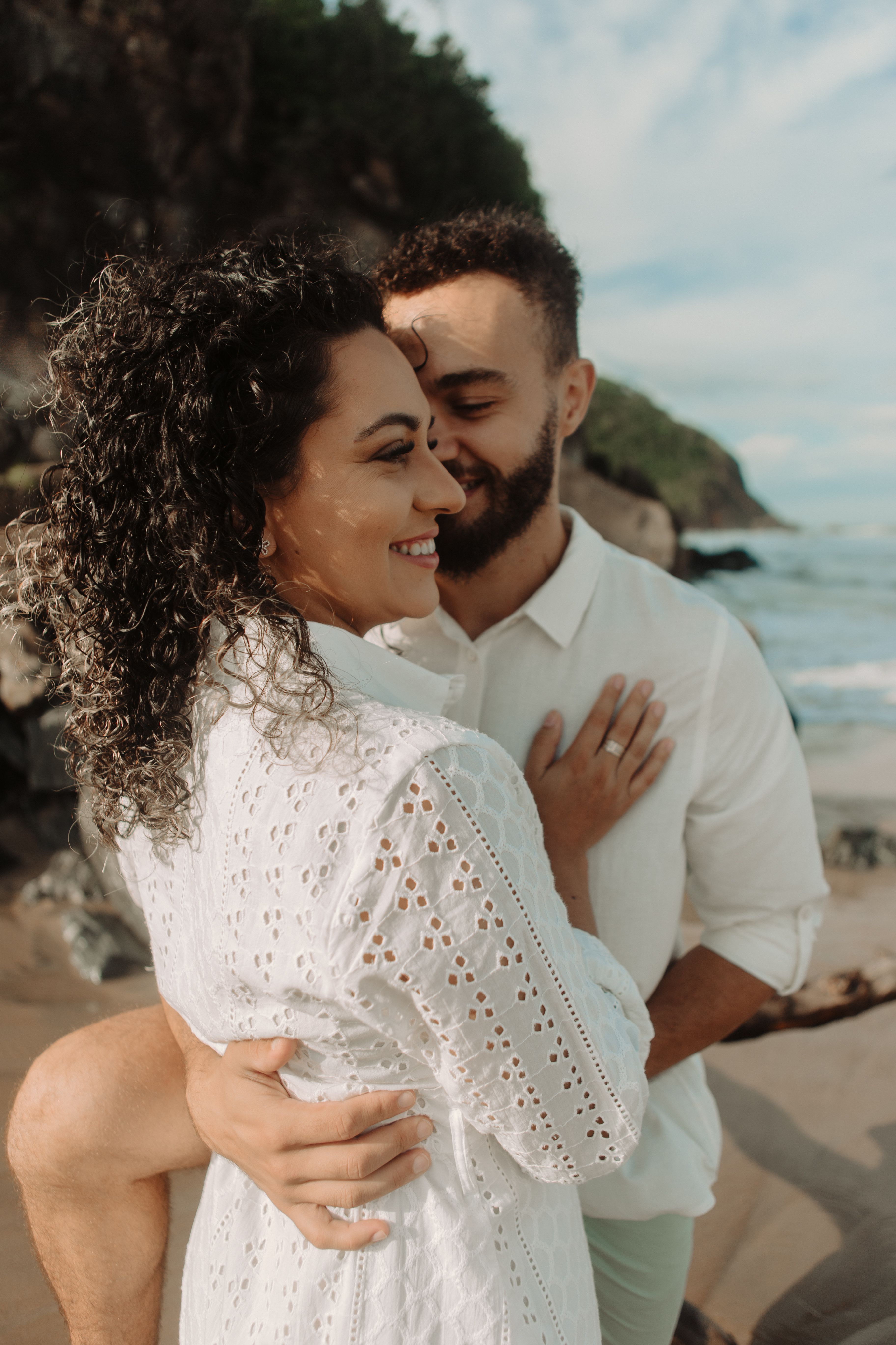 Romantic Beach Couple Embracing at Sunset · Free Stock Photo