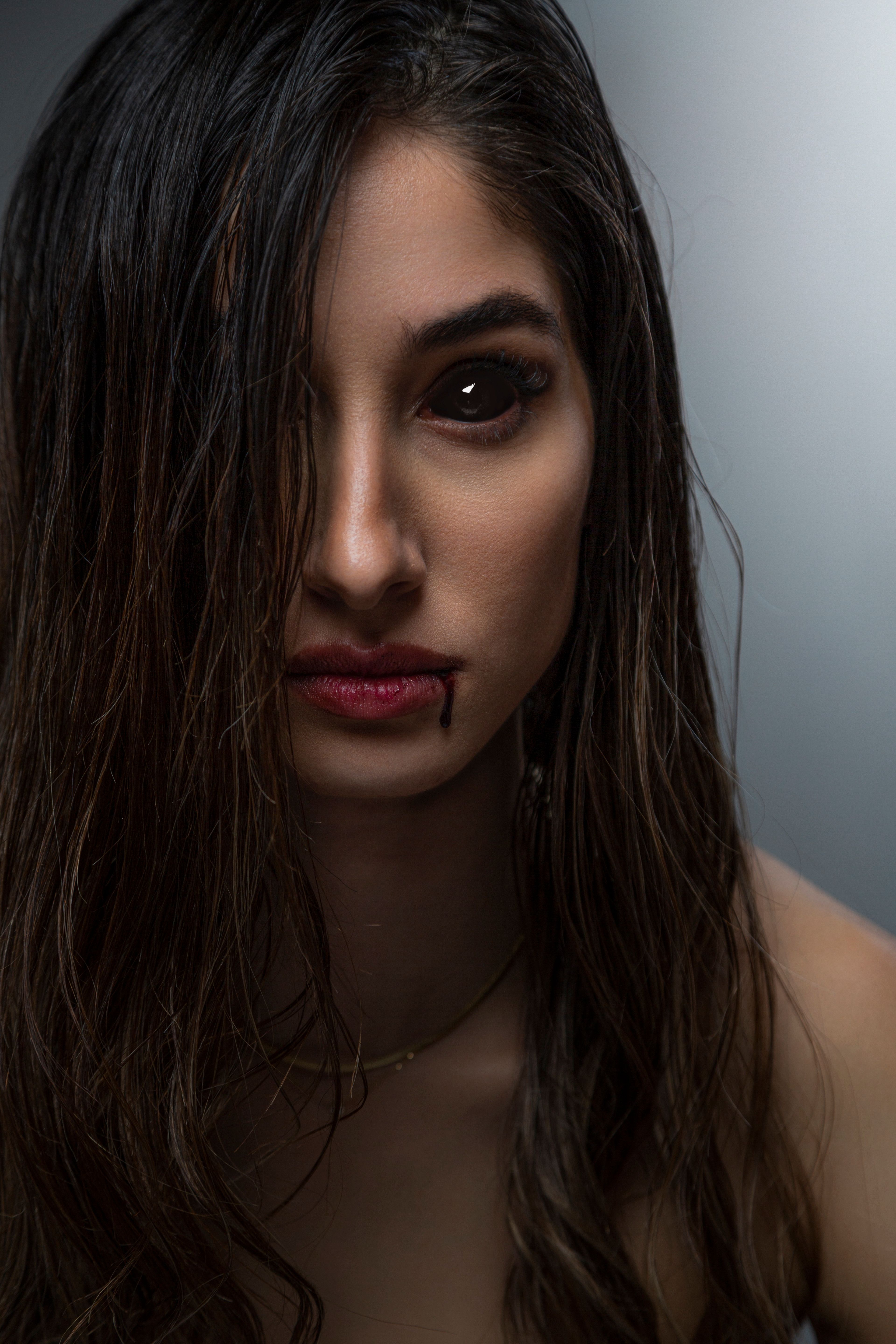 Dramatic Portrait of a Woman with Intense Gaze · Free Stock Photo