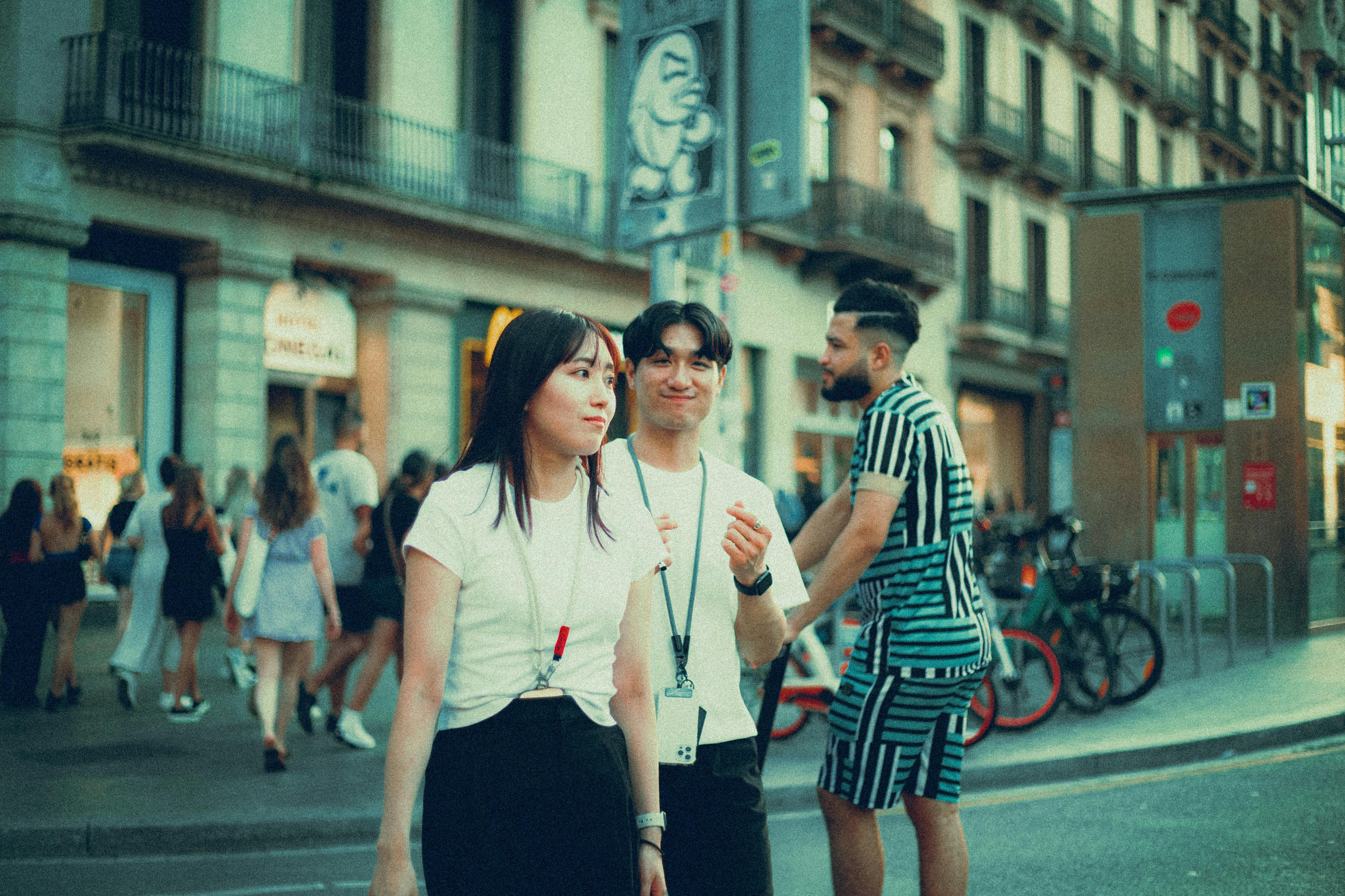 A lively street scene in Chicago's West Loop, showcasing modern buildings, busy restaurants with outdoor seating, and people enjoying the vibrant urban atmosphere - one bedroom apartments chicago