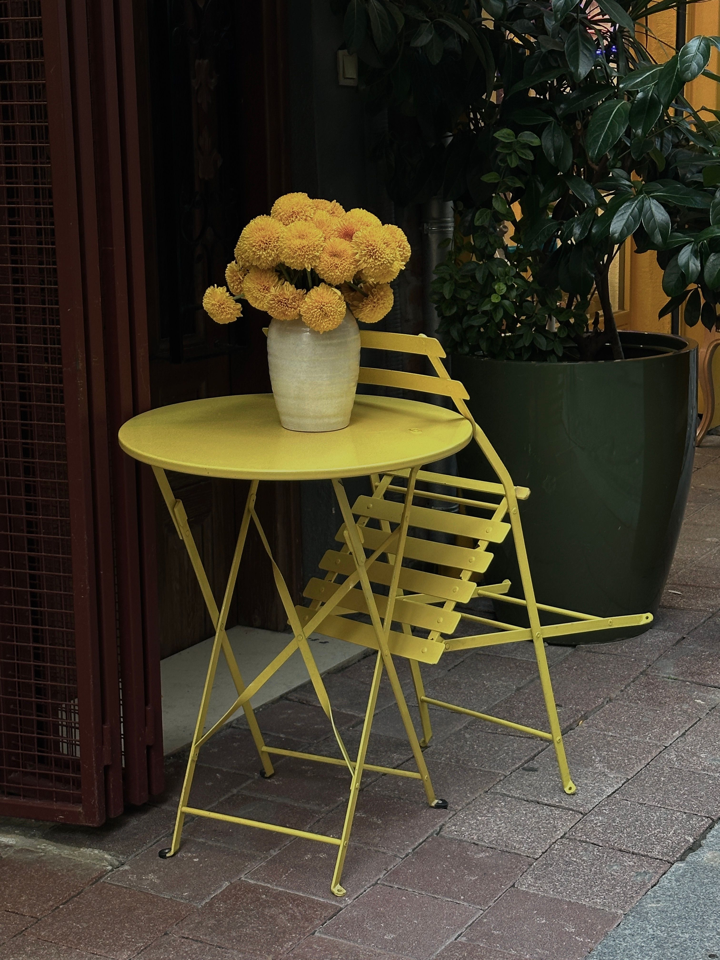 Yellow Bistro Table with Flowers in Istanbul · Free Stock Photo
