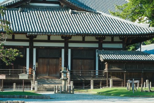 Free A serene view of an ancient Japanese temple with traditional architecture, captured in daylight. Stock Photo