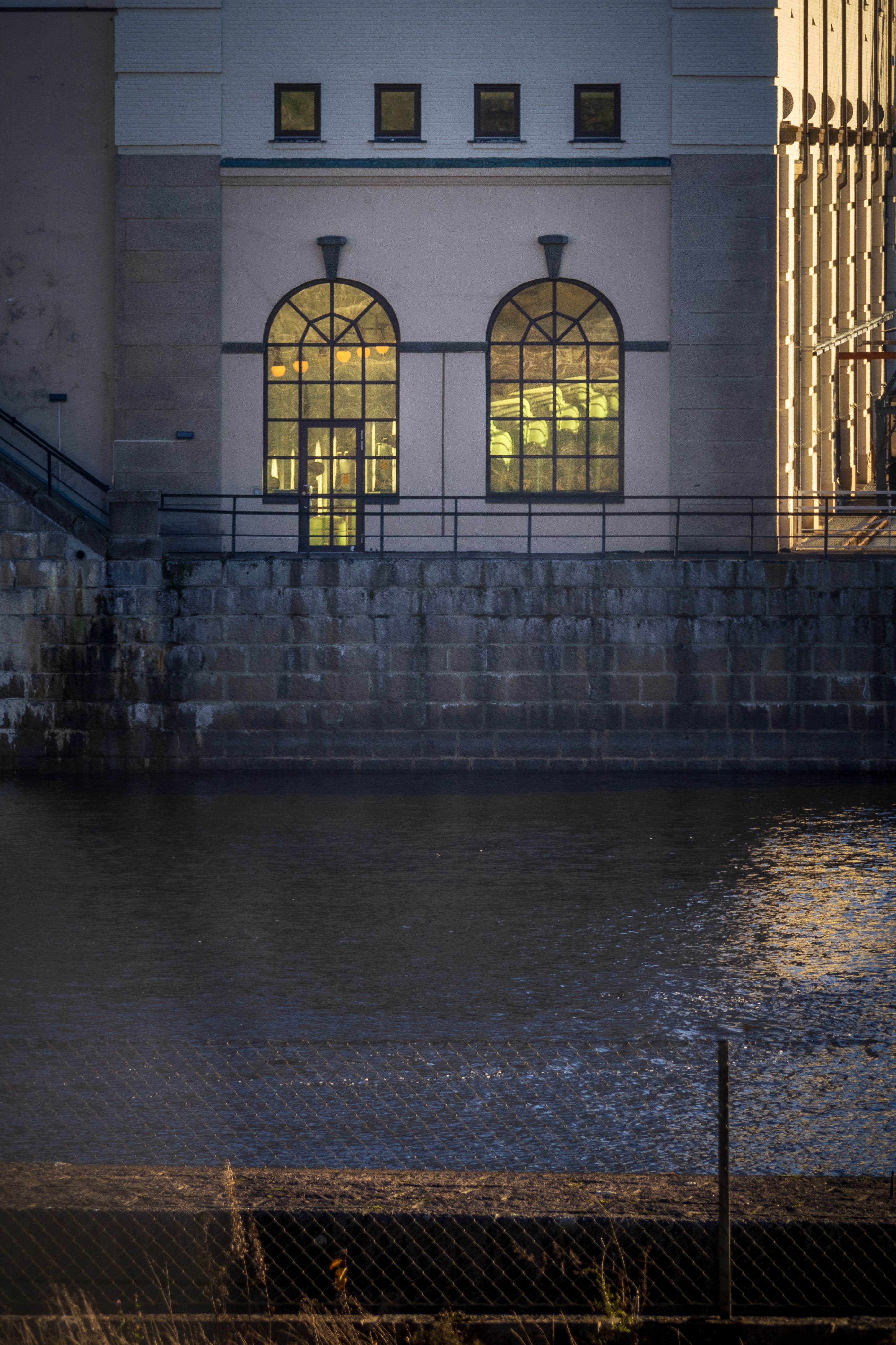 Elegant Industrial Building Overlooking Water · Free Stock Photo