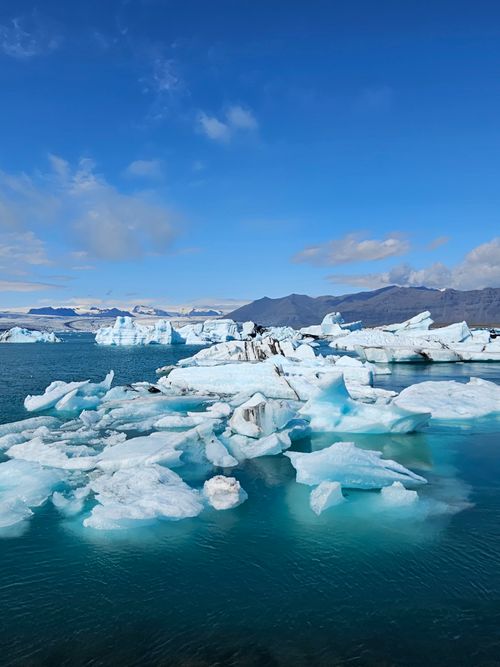 Free Majestic icebergs floating in Jökulsárlón lagoon, Iceland, under a clear blue sky. Stock Photo