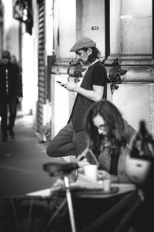 Free Black and white photo of people on a city street showing urban lifestyle. Stock Photo
