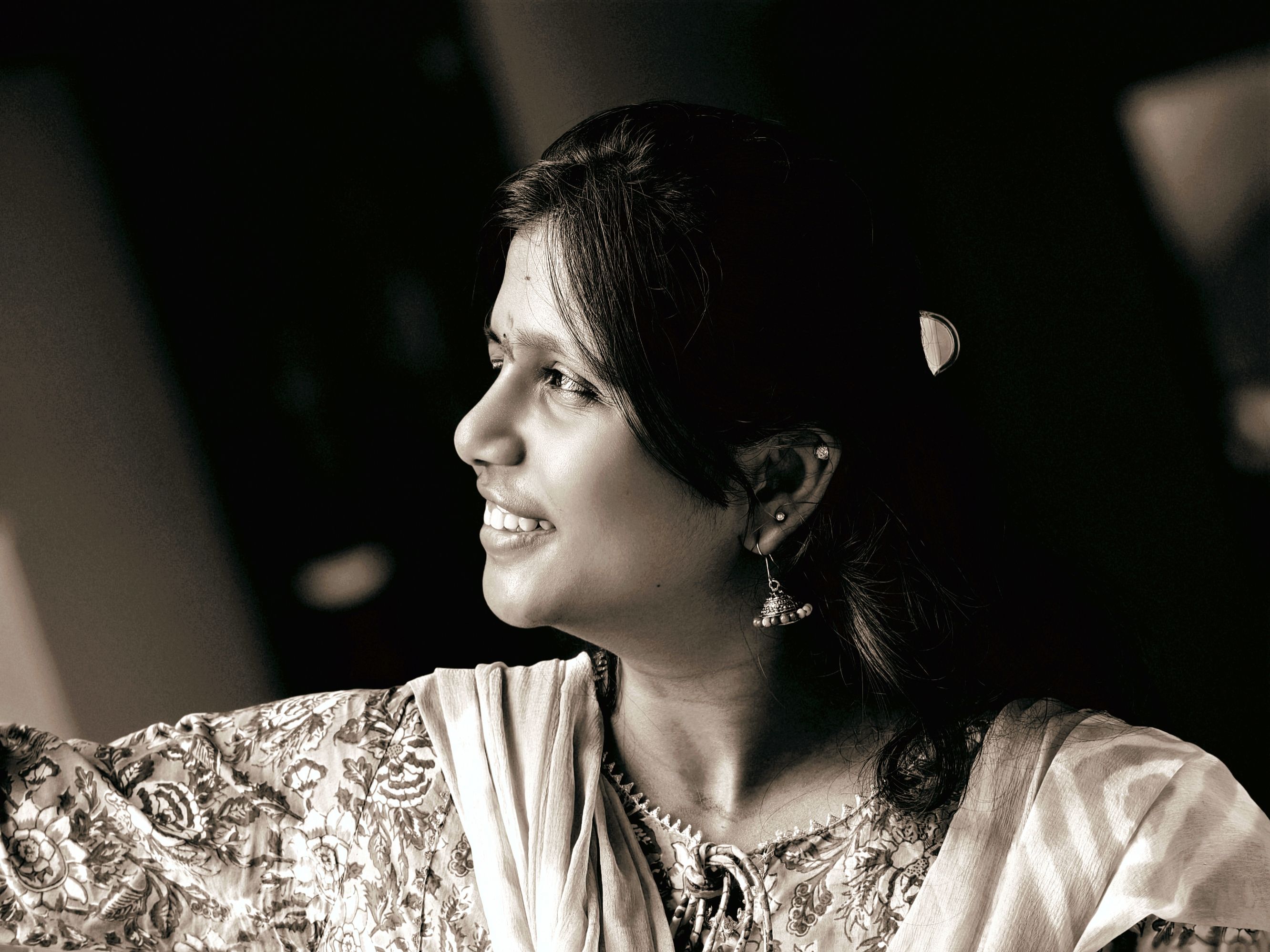 Smiling Woman in Traditional Clothing Indoors · Free Stock Photo