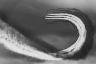 Monochrome Photo of Jet Flying Through the Air