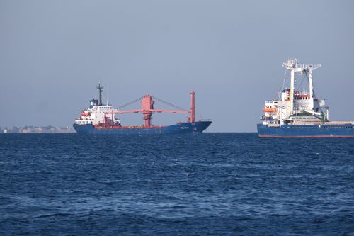 Free Two container ships sailing in the open sea, under a clear blue sky, captured in bright daylight. Stock Photo