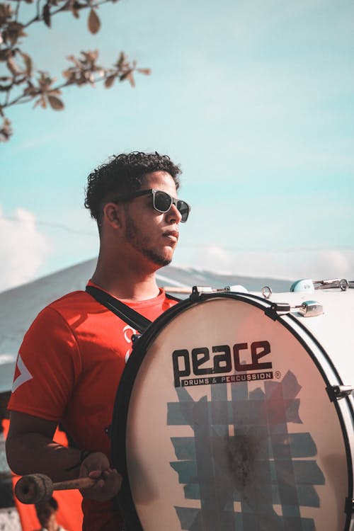 Man Playing Drums During Parade