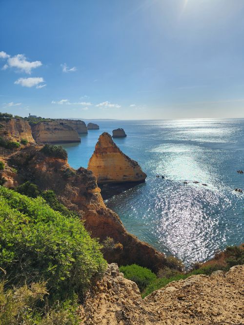 Free Stunning coastal cliffs and sparkling ocean waters at Algarve, Portugal. Stock Photo