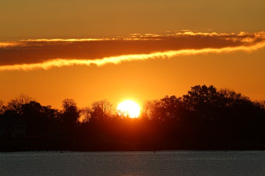 Stunning autumn sunrise over Cove Island Park, Stamford, highlighting vibrant fall colors.