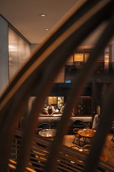Warm, inviting cafe in London with industrial design and stylish decor. Ideal for dining photography.