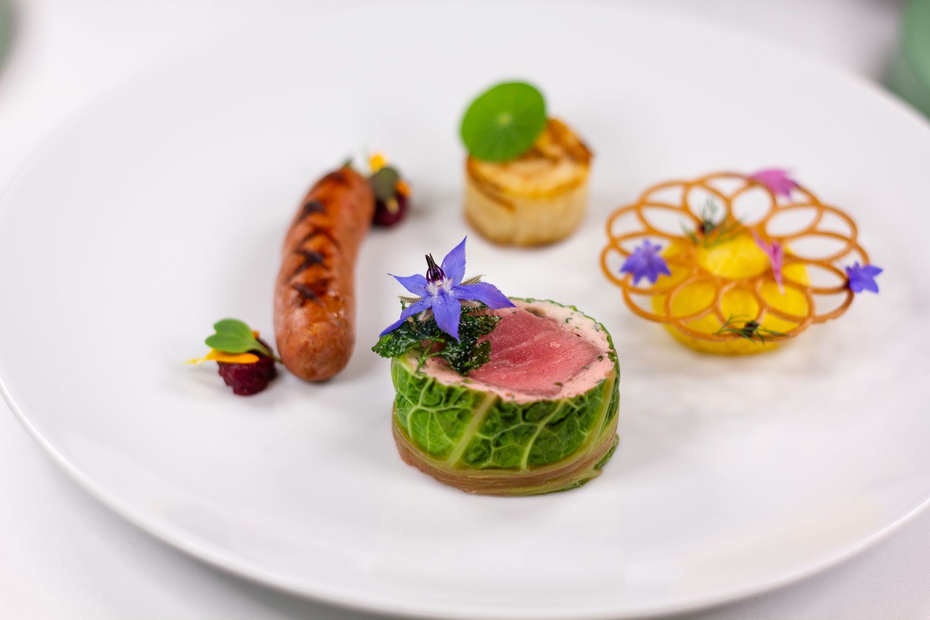 Exquisite gourmet dish featuring artistic presentation with vibrant colors and delicate ingredients.