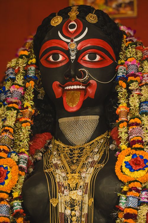 Free Intricately decorated Goddess Kali idol on display during a Kolkata festival, showcasing vibrant colors and traditional adornments. Stock Photo