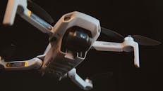 Close-up of Mavic Mini Drone Flying in Dark Environment