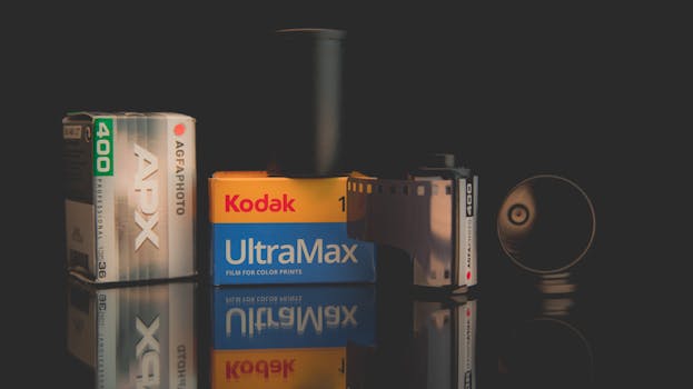 Vintage film rolls featuring Kodak UltraMax and AgfaPhoto APX against a dark background.