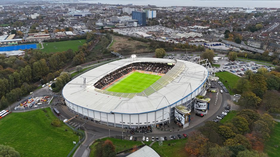 Aerial image of KCOM Stadium, Hull, showing a bustling crowd and a vibrant cityscape.