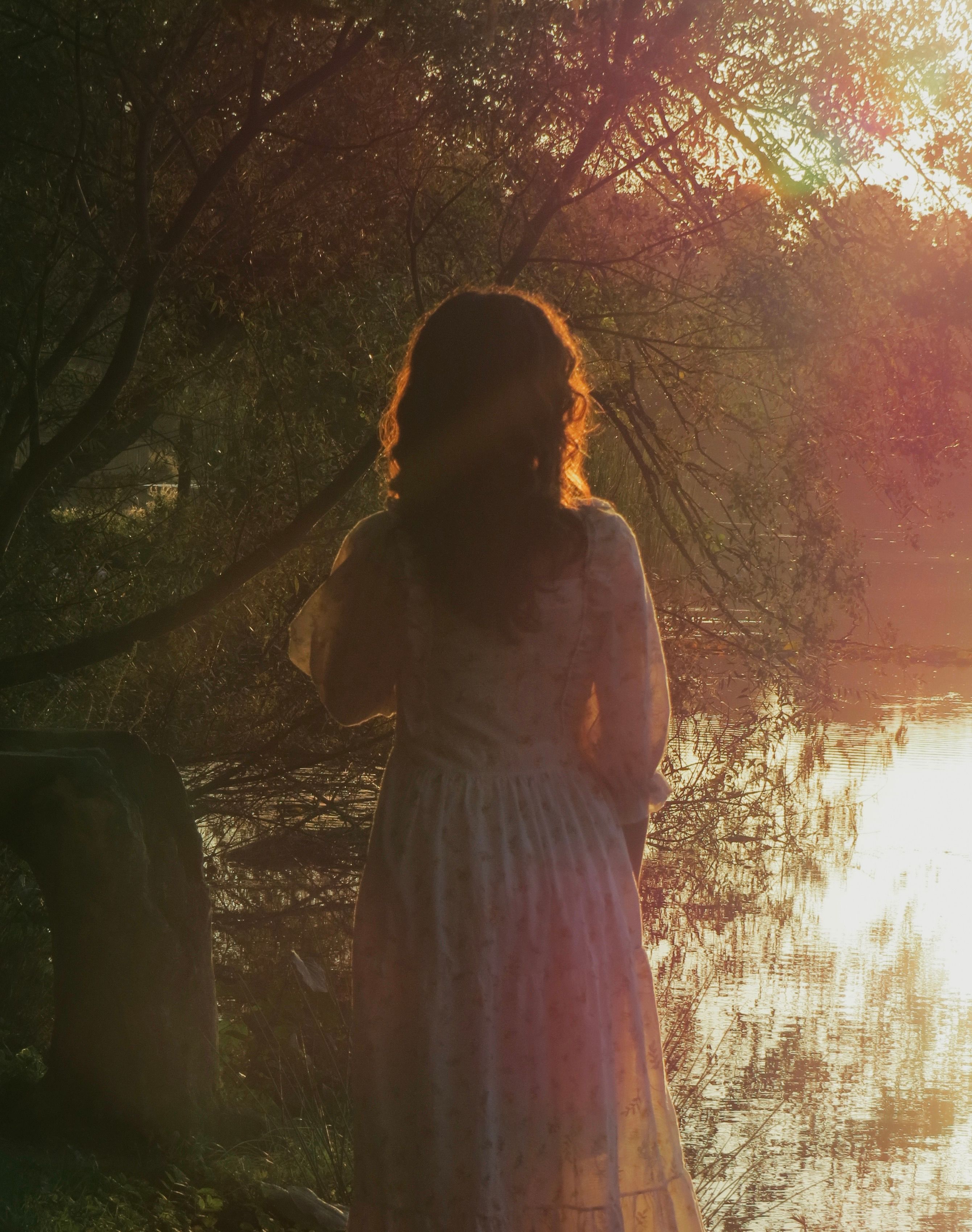 Woman in Vintage Dress by Serene Lake at Sunset · Free Stock Photo
