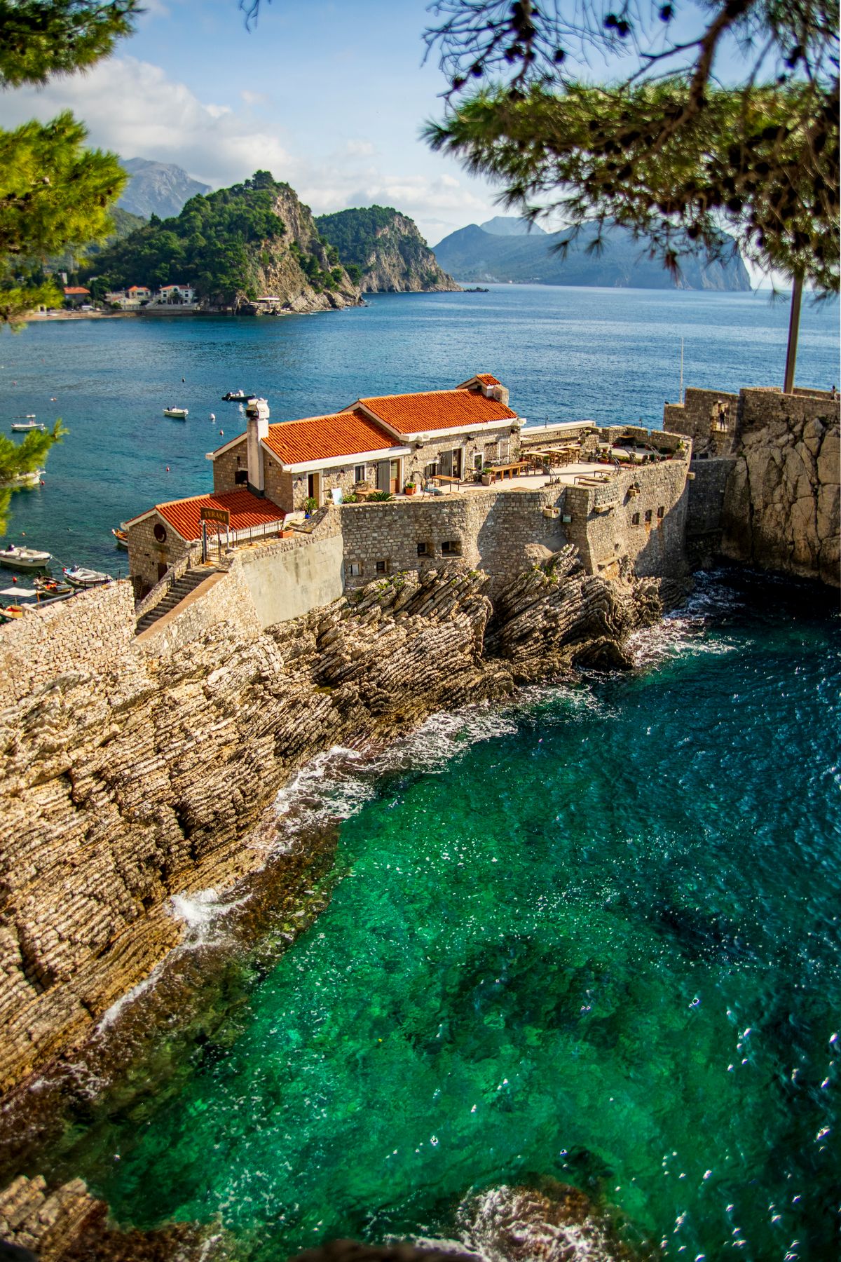 A scenic coastal village with historic stone walls in Montenegro on the Bay of Kotor