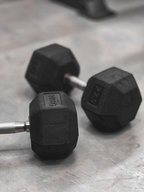 Pair of black rubber hex dumbbells