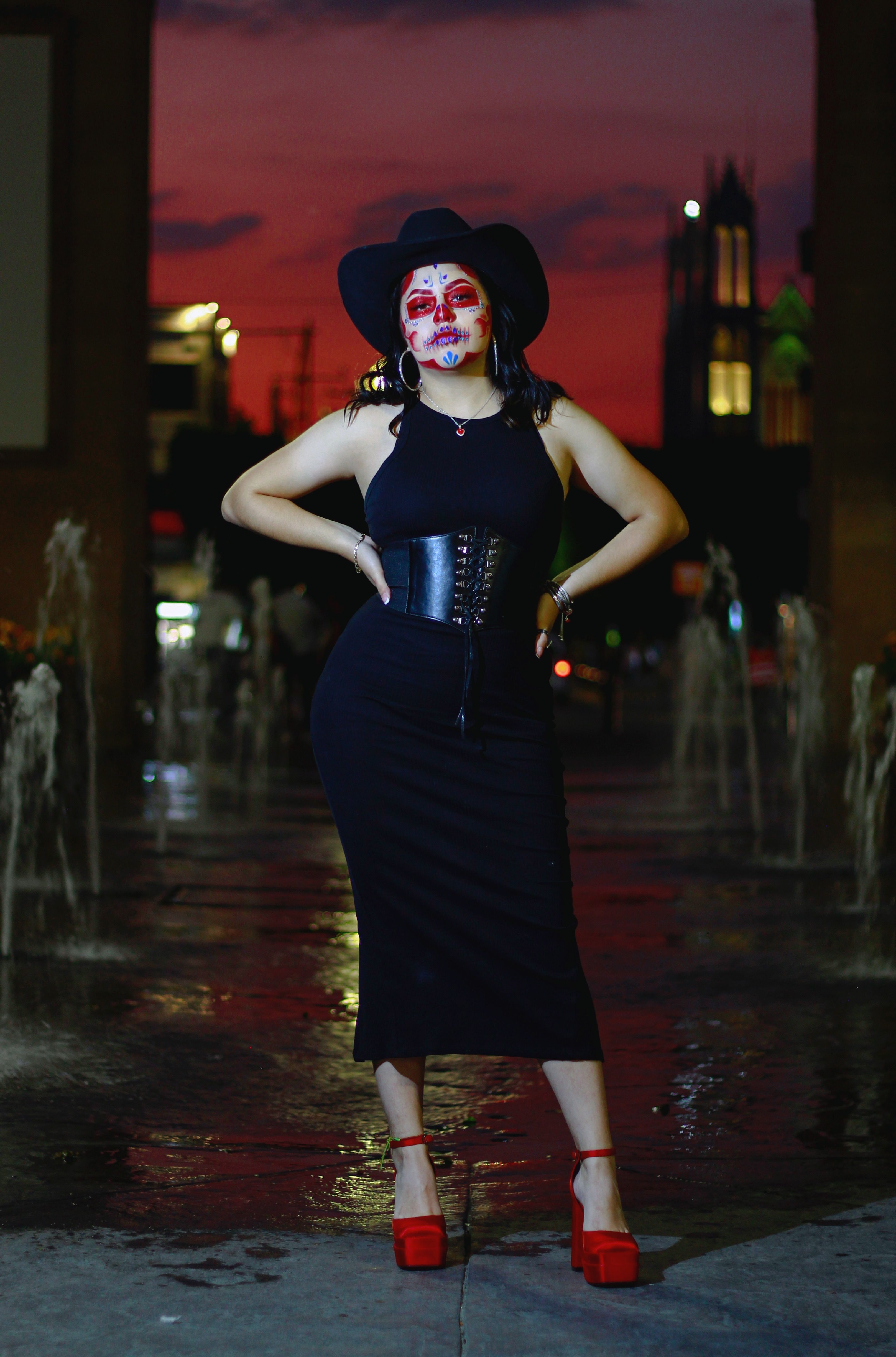 Black midi dress with red heels