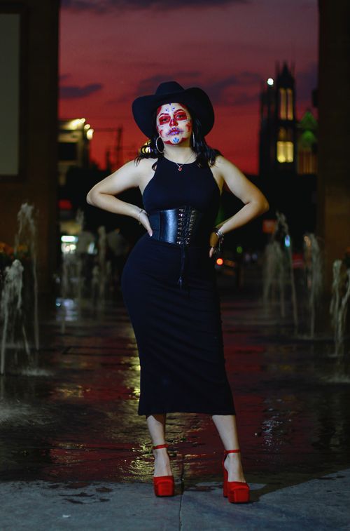 Black midi dress with red heels