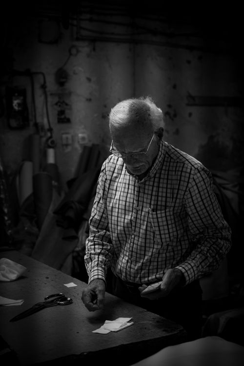 Free A senior man works meticulously in his Istanbul workshop, evoking a sense of nostalgia. Stock Photo